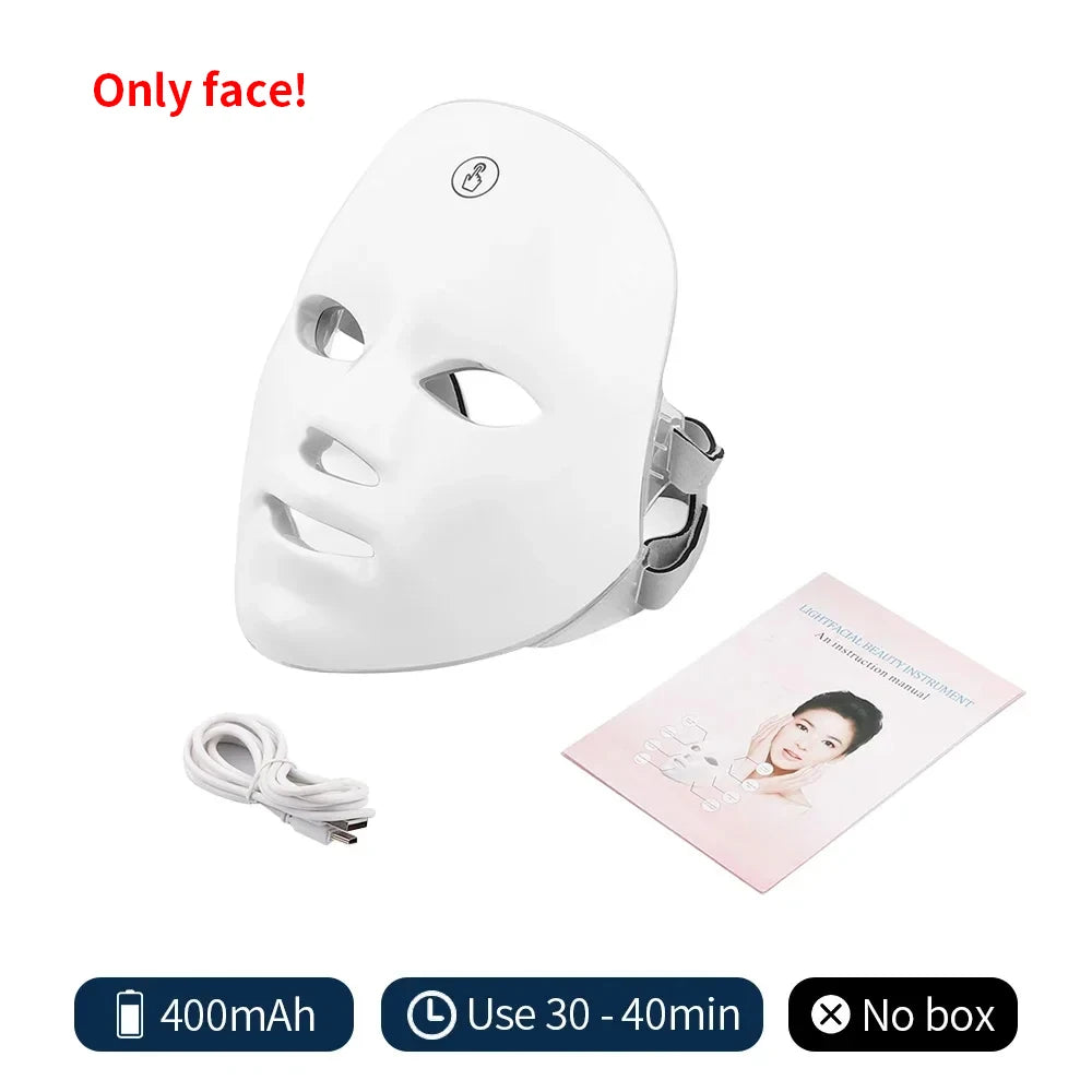 White LED face mask with charging cable and user manual on a white background
